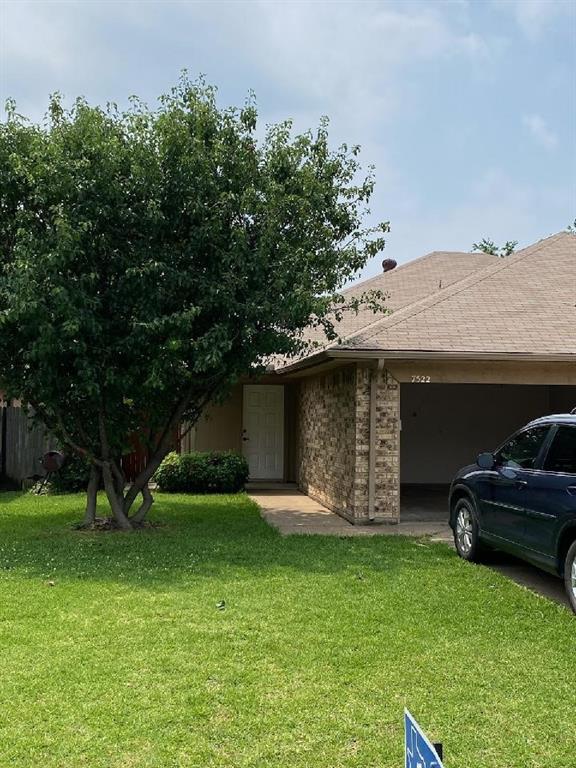 a view of a house with a yard