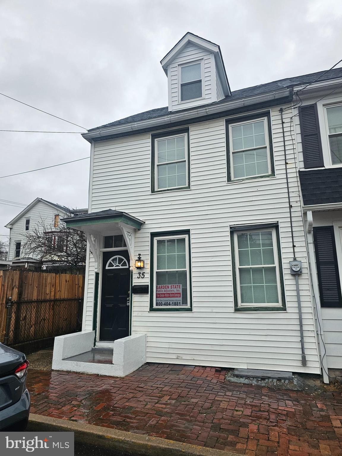 a front view of a house with a porch