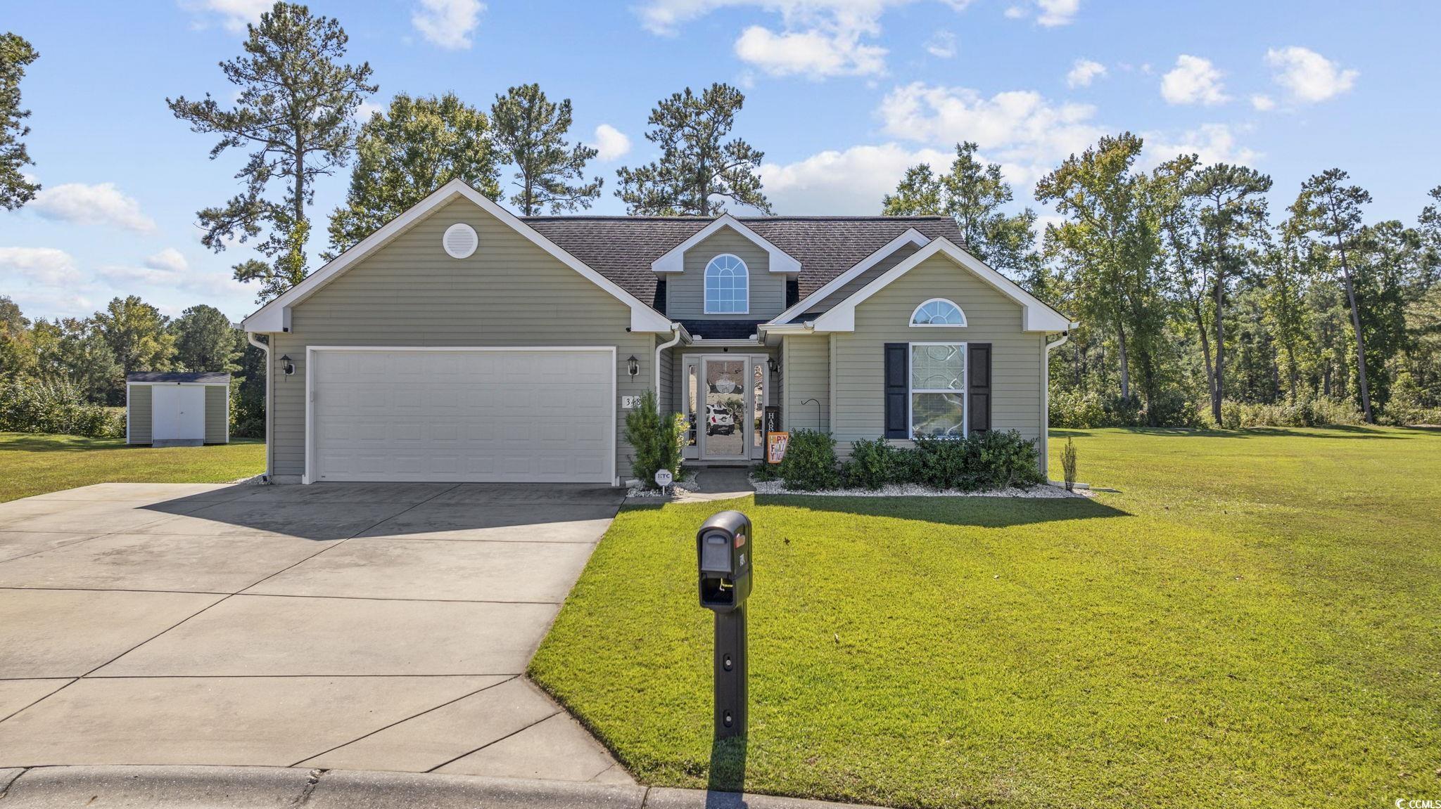 View of front of property featuring a front yard a