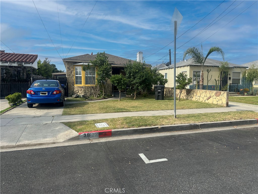 a view of street with parked cars