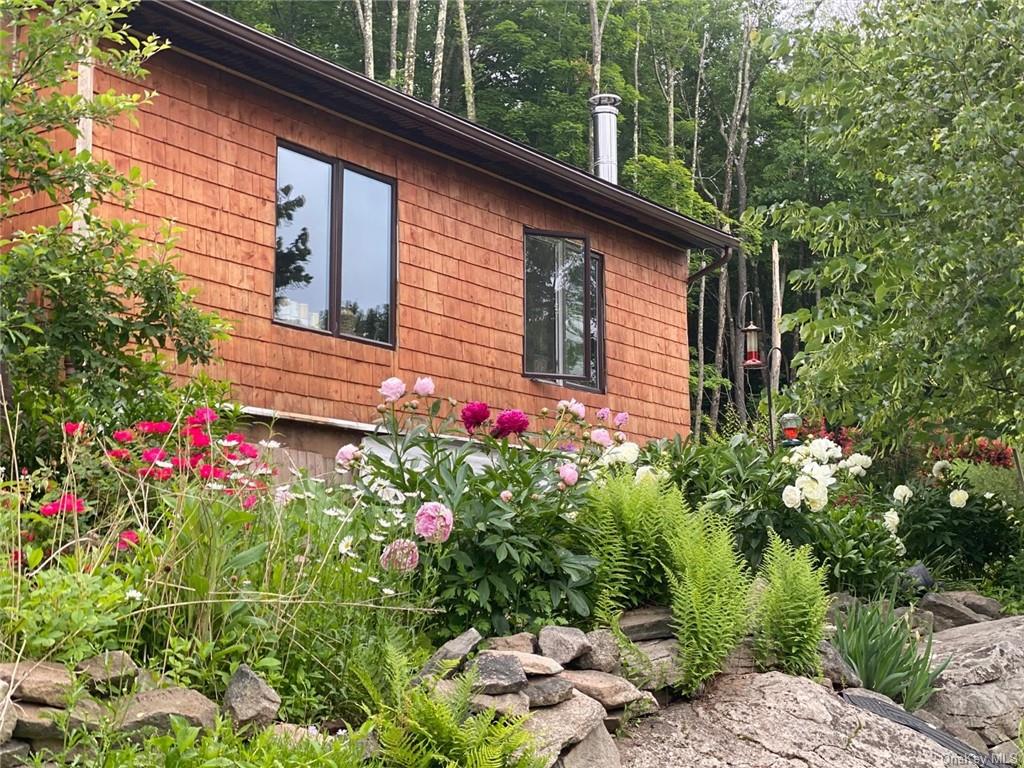 a flower plants sitting in front of a house