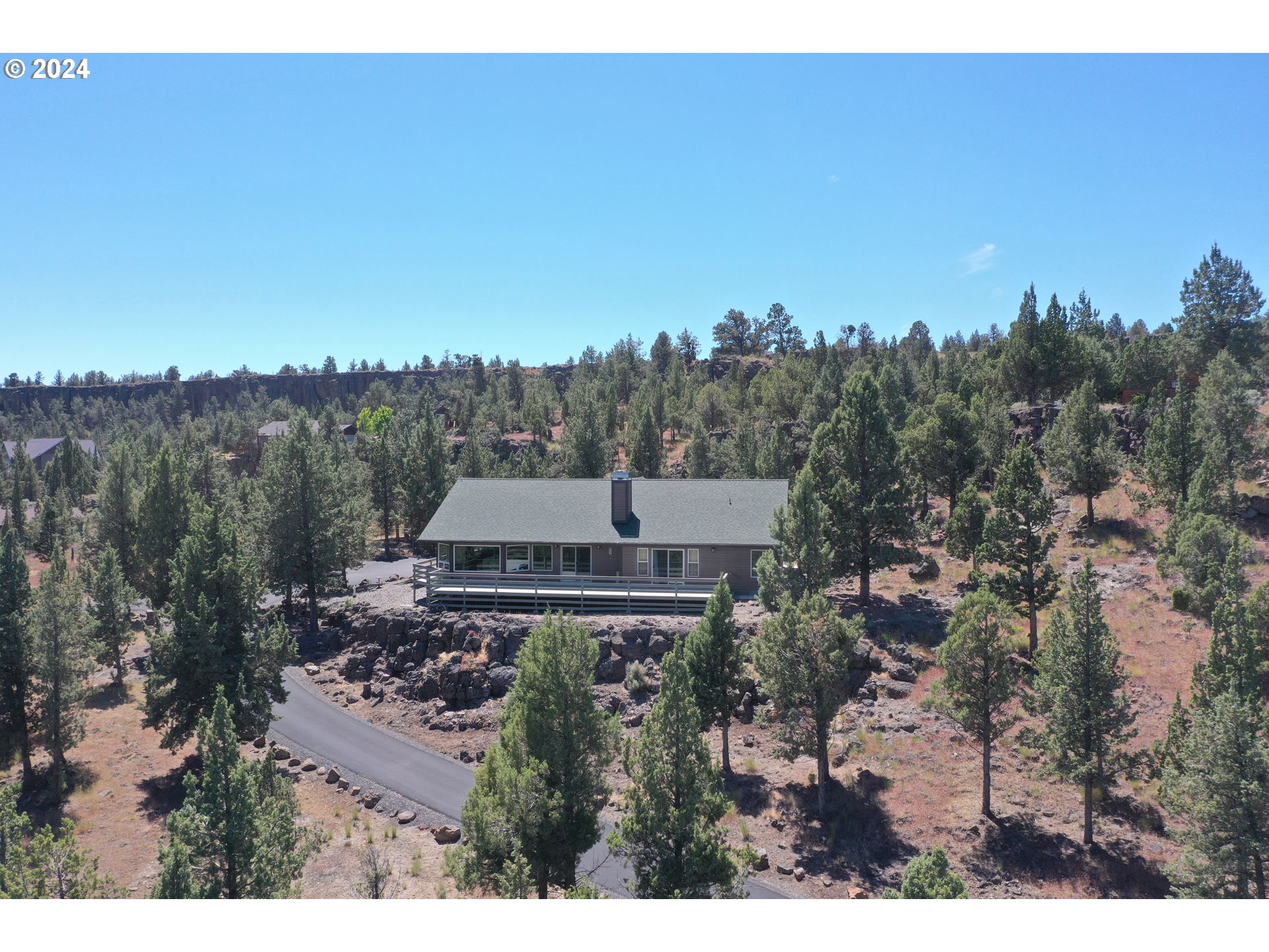 an aerial view of a house with a garden