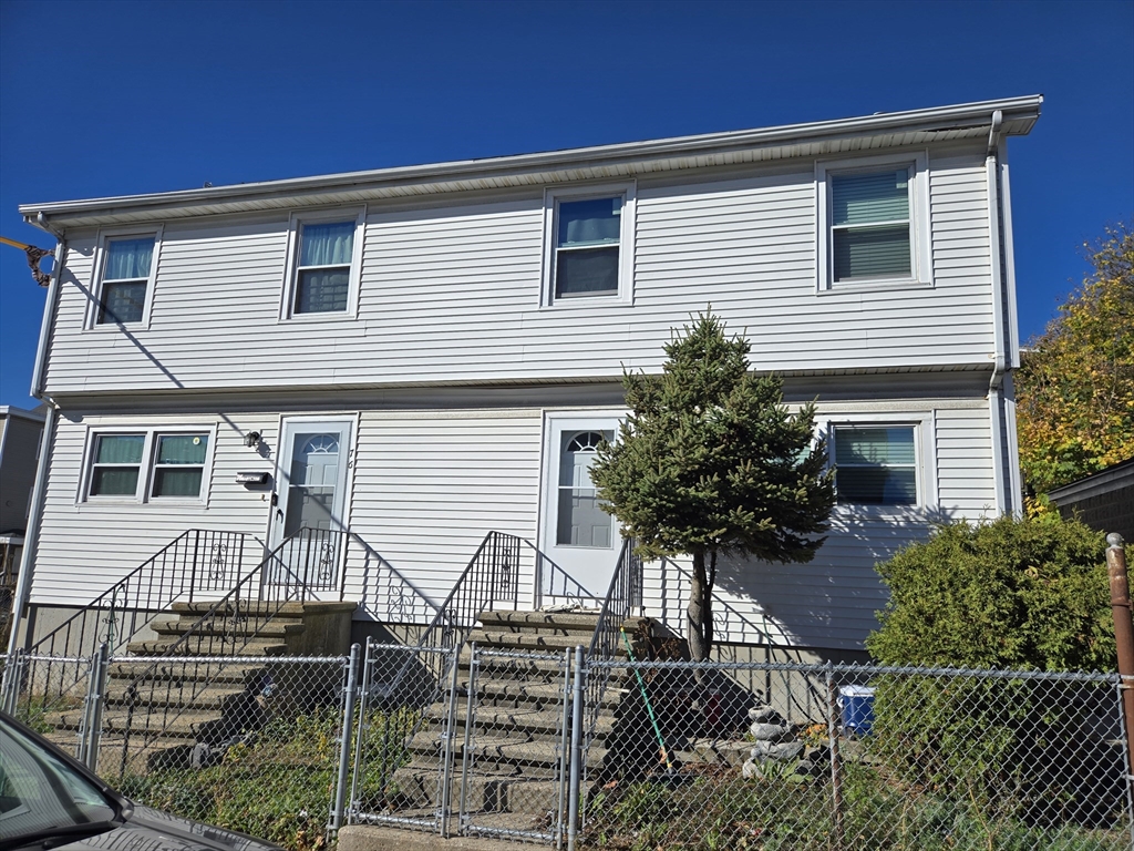 a front view of a house with yard