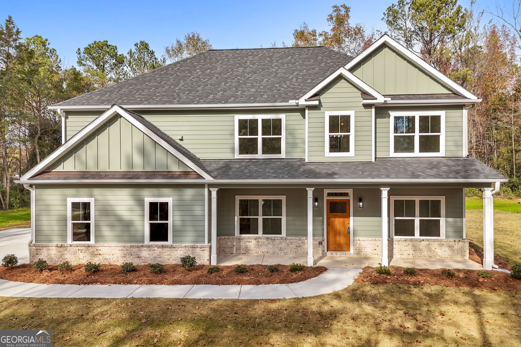 a house with trees in the background