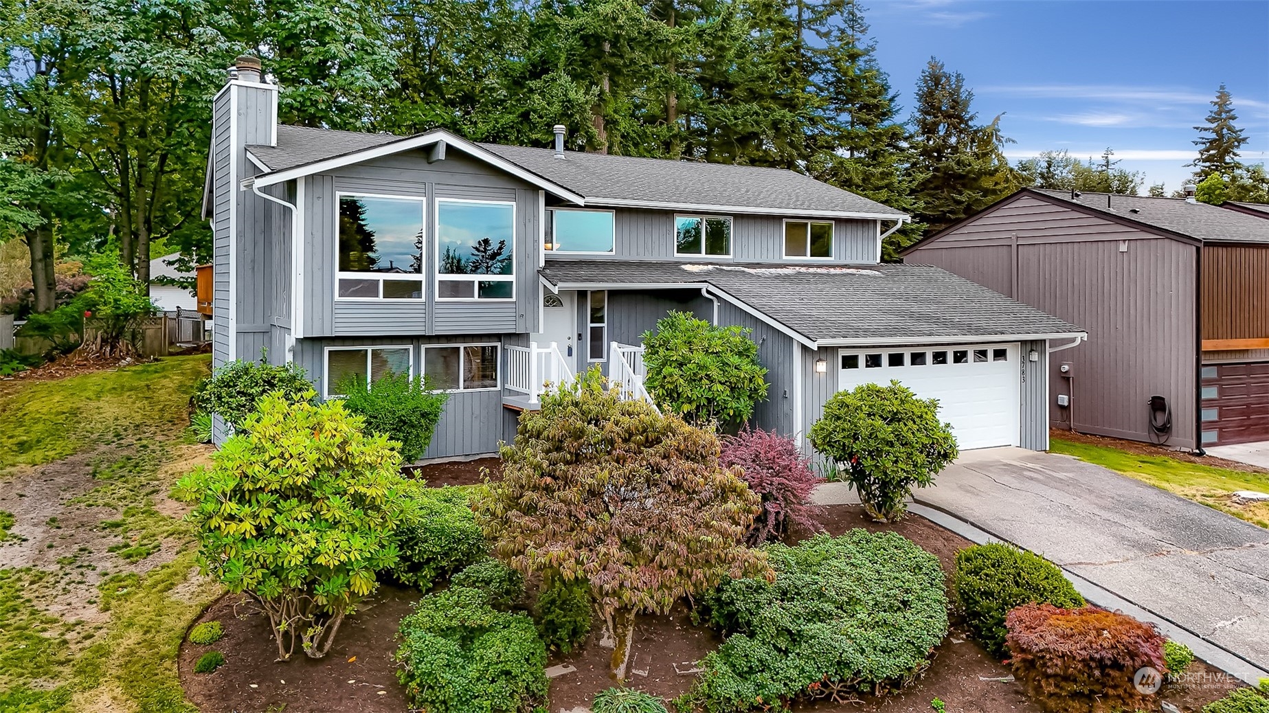 a front view of a house with garden