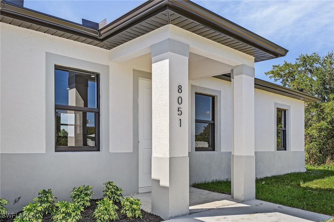 a front view of a house with garage