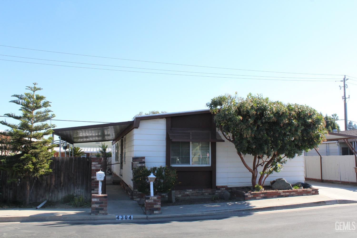 a view of a house with a tree