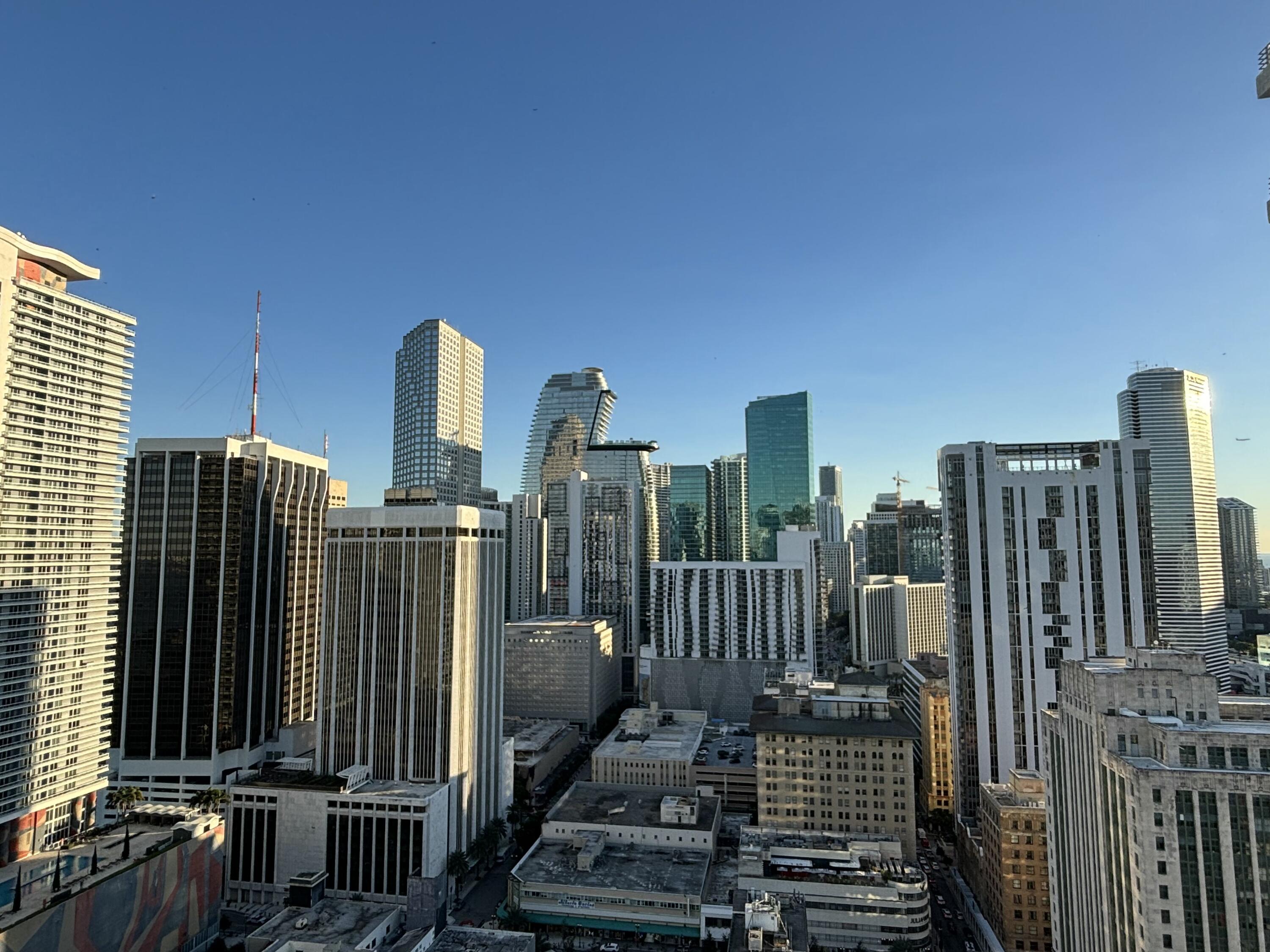 a view of a city with tall buildings