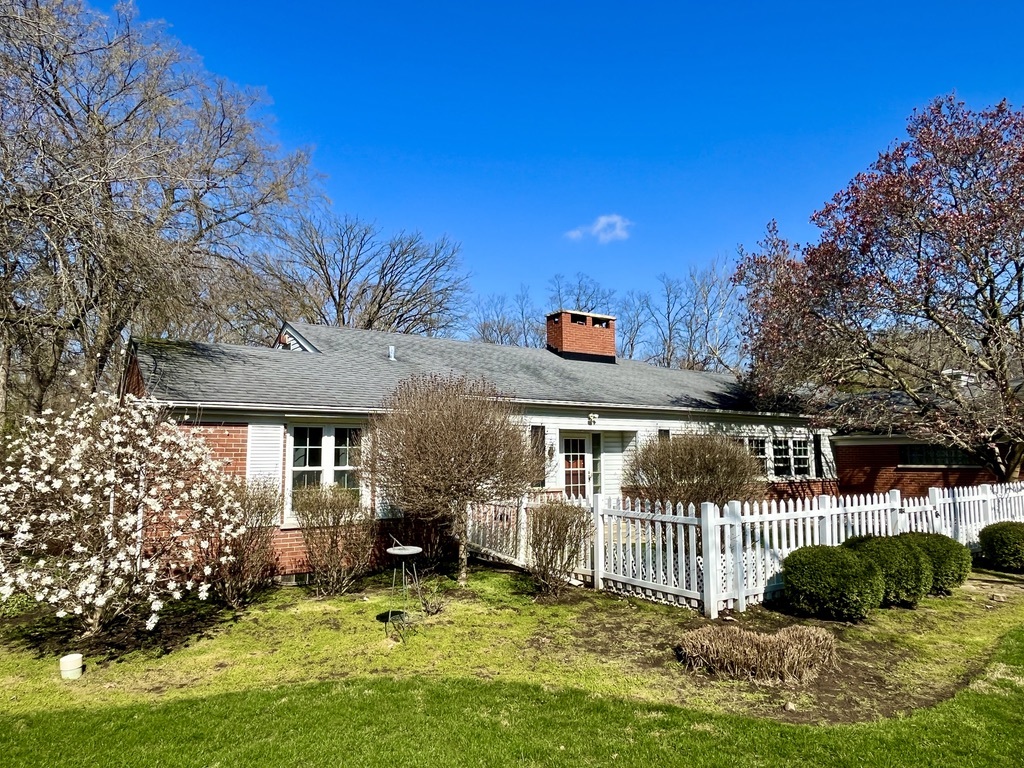 a view of a house with a small yard