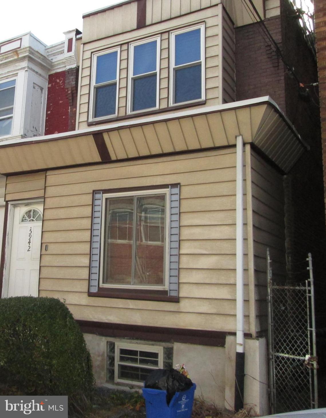 a view of a house with a window and brick walls