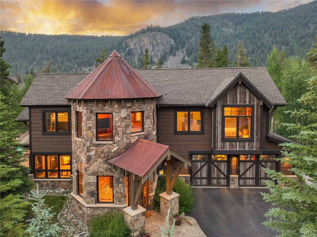 an aerial view of a house next to a yard