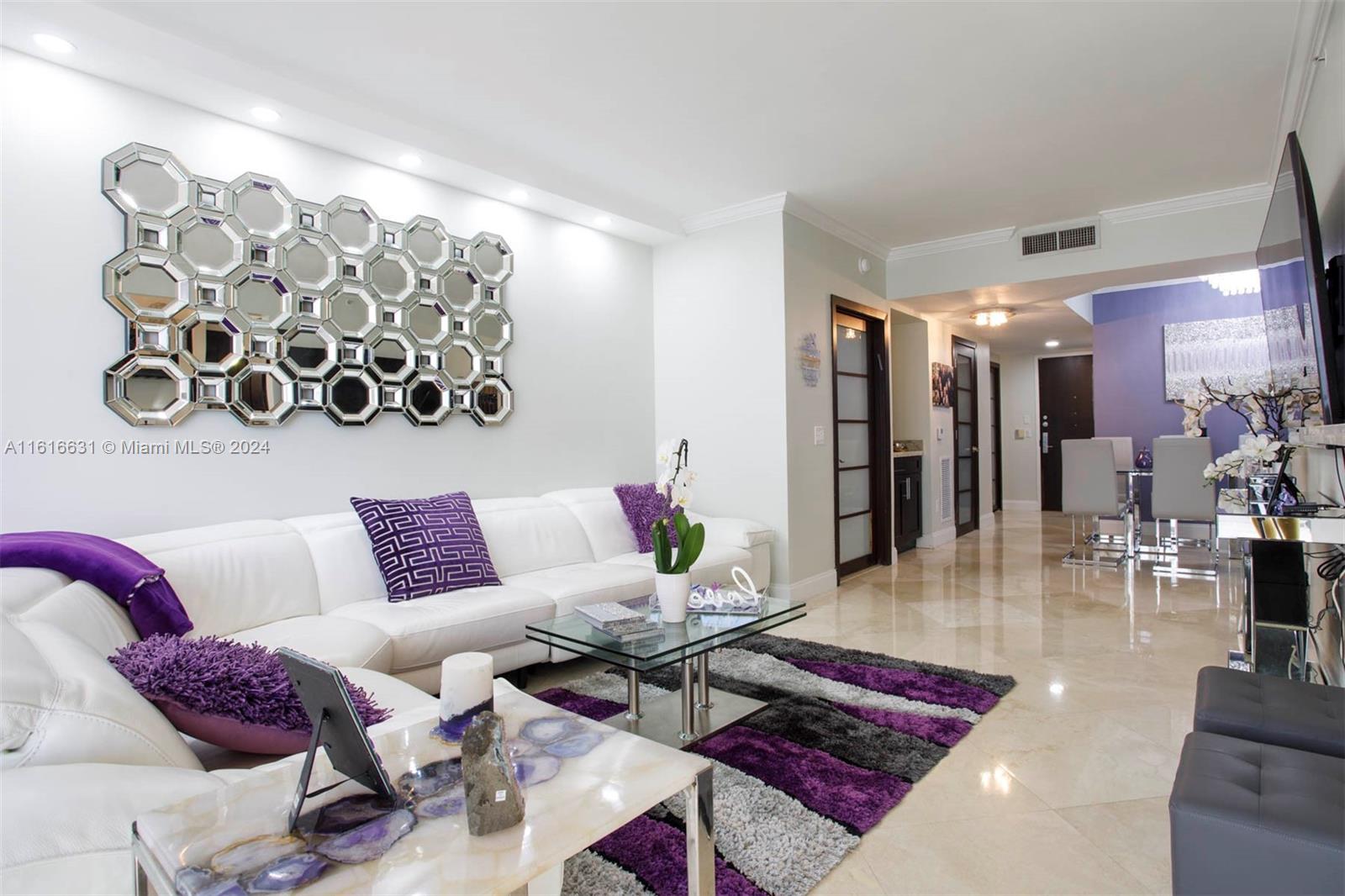 a living room with furniture and a rug