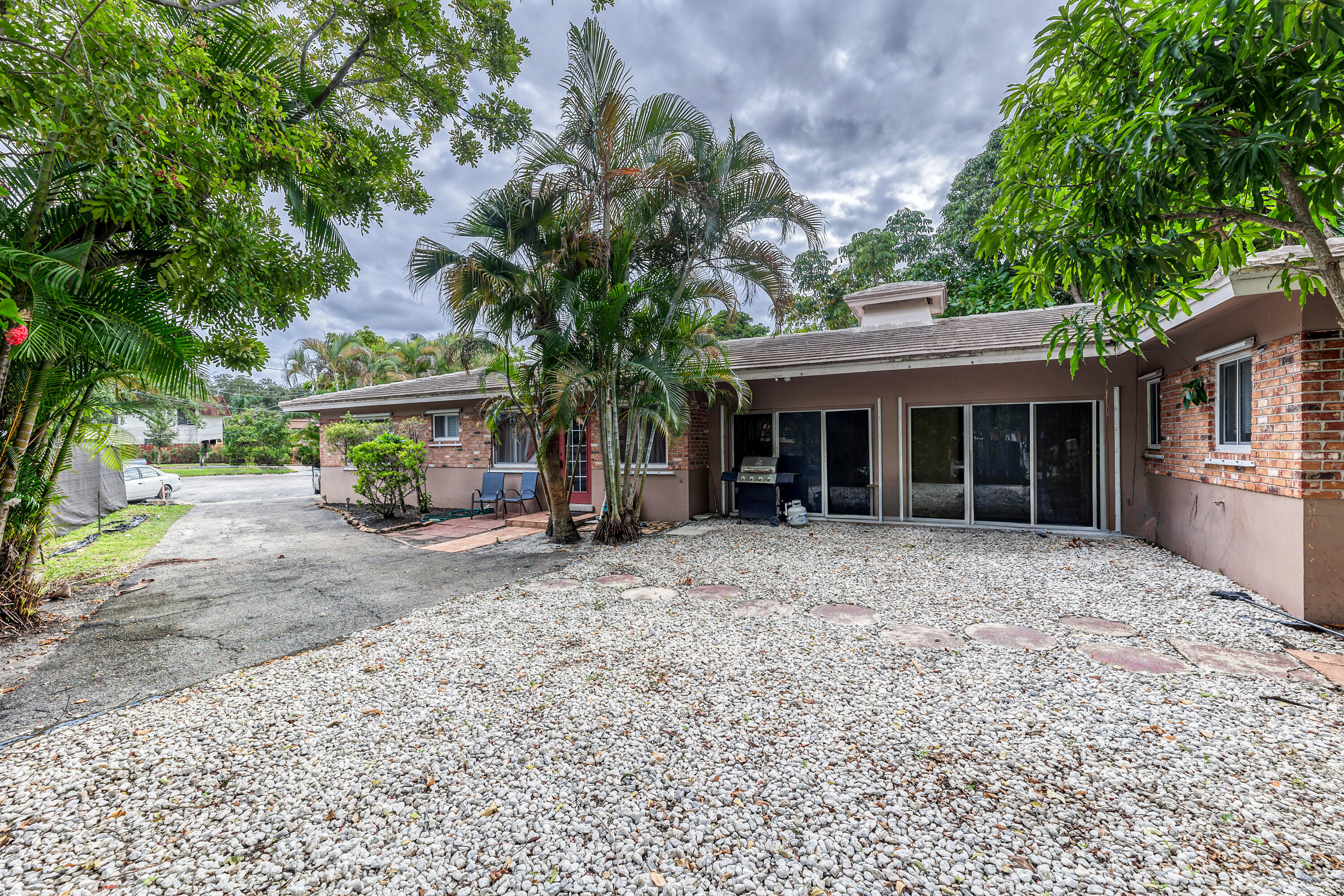 a view of a house with a yard and a garage