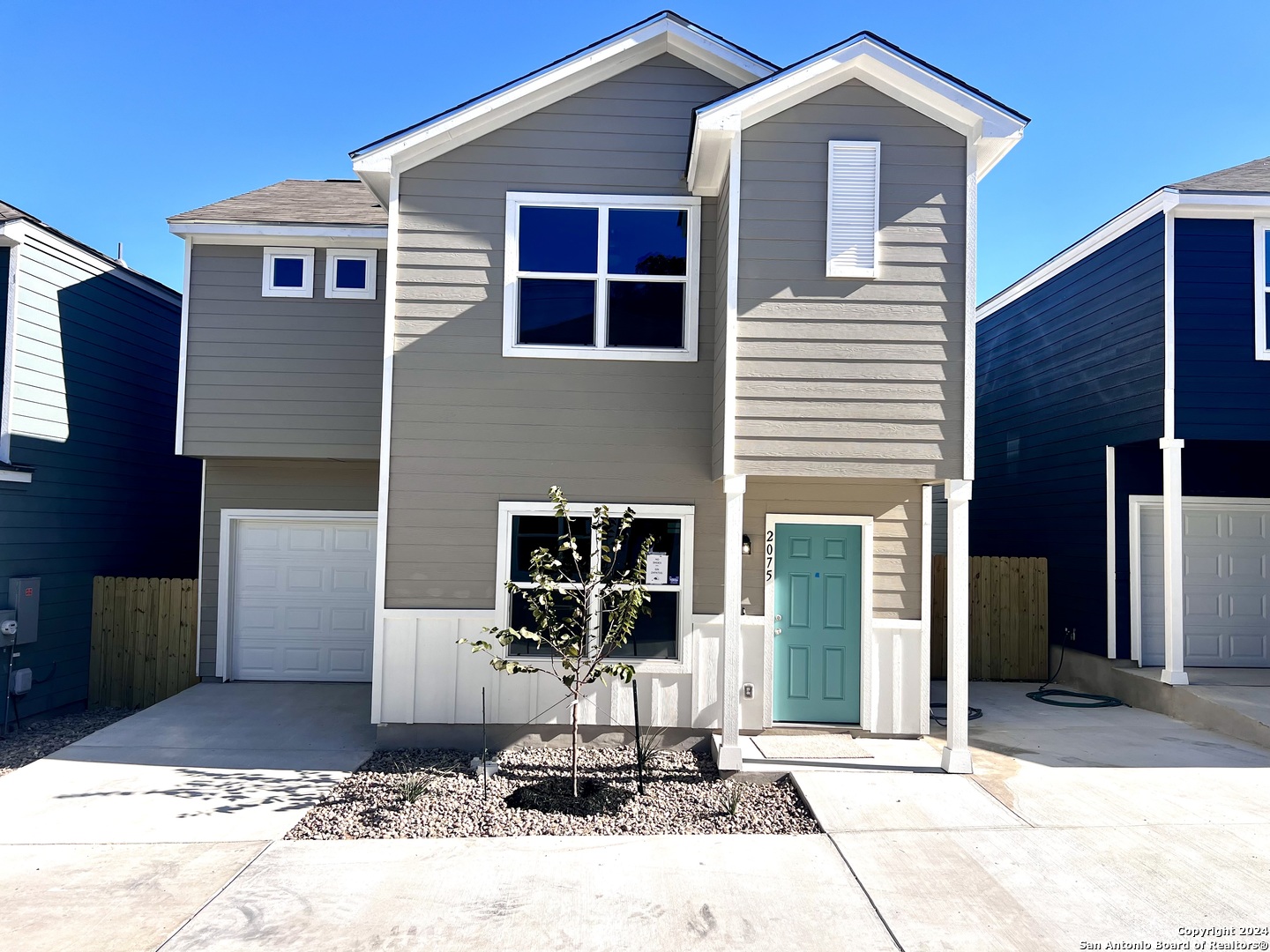 a front view of a house with sitting area