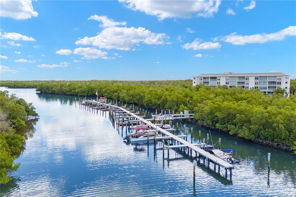 a view of a lake with a table and chairs