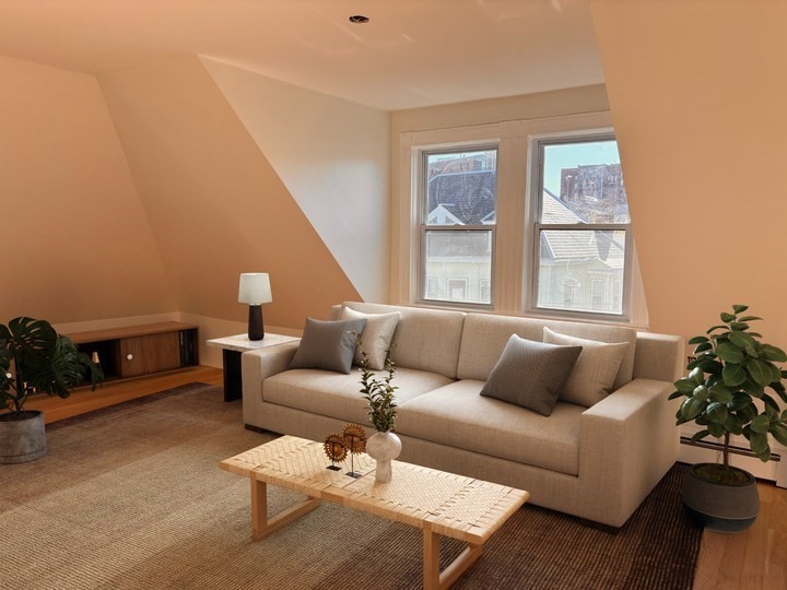 a living room with furniture and a window