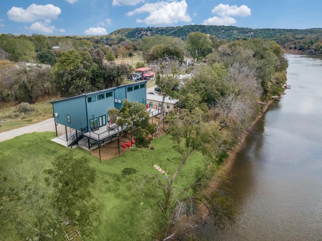 an aerial view of a house with a yard