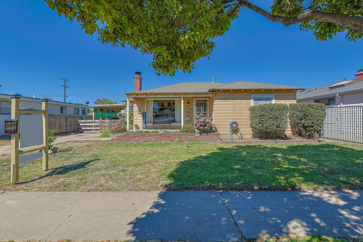 a front view of a house with garden