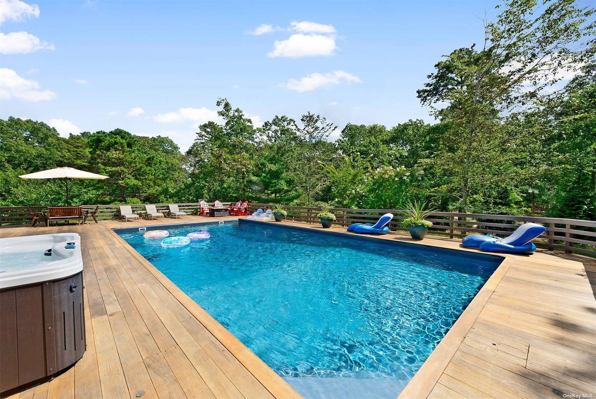 a view of a swimming pool with a lounge chair