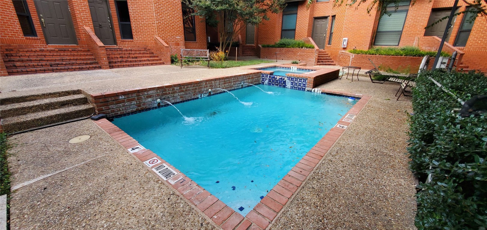 a swimming pool with outdoor seating and yard