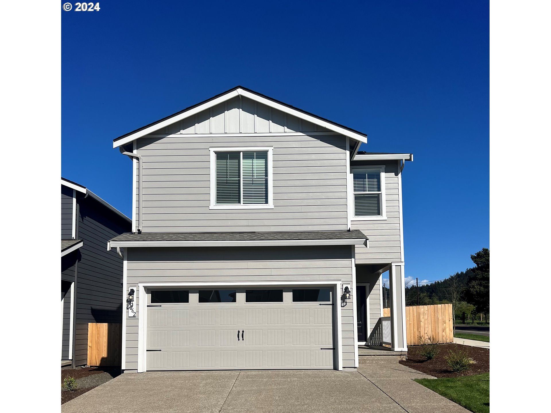 a front view of a house with a garage