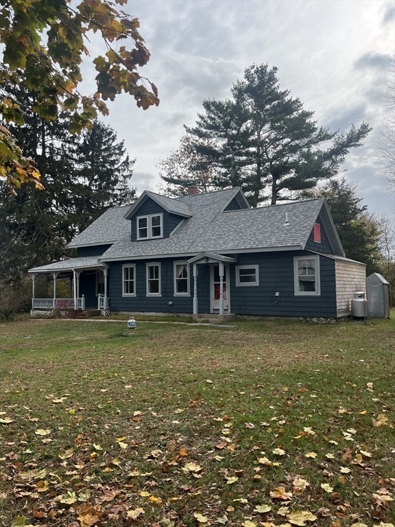 a front of a house with a garden