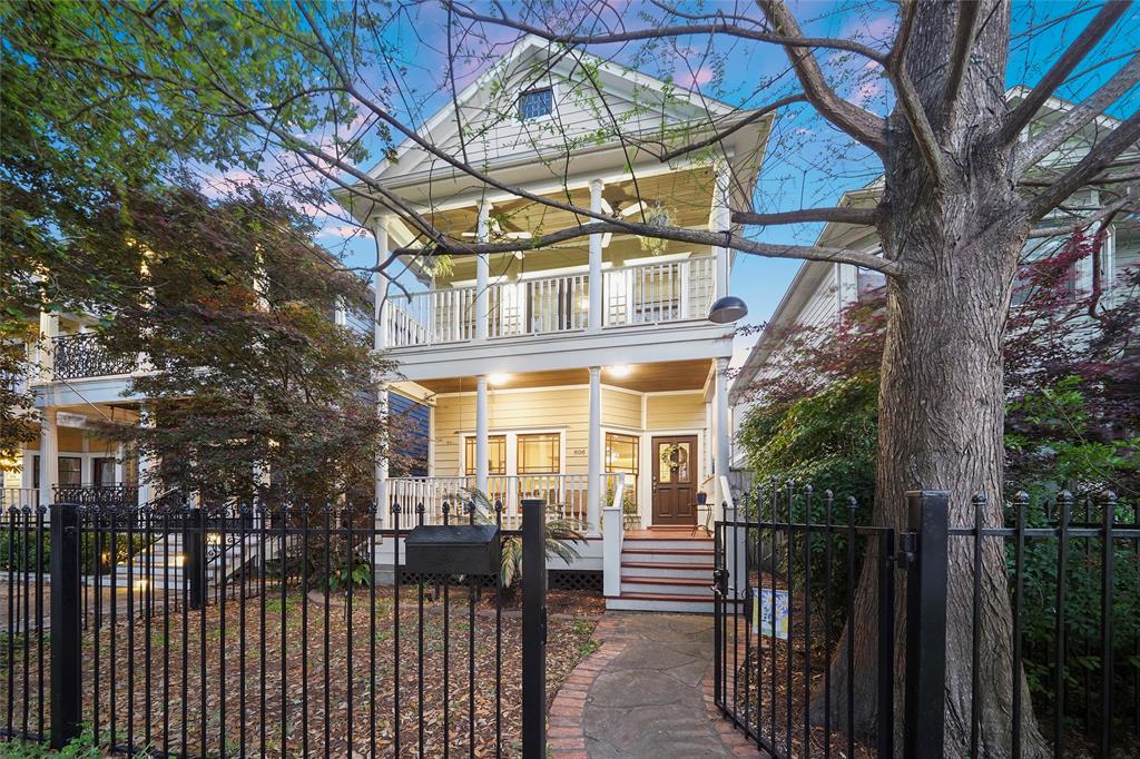 a view of a house with a iron gate