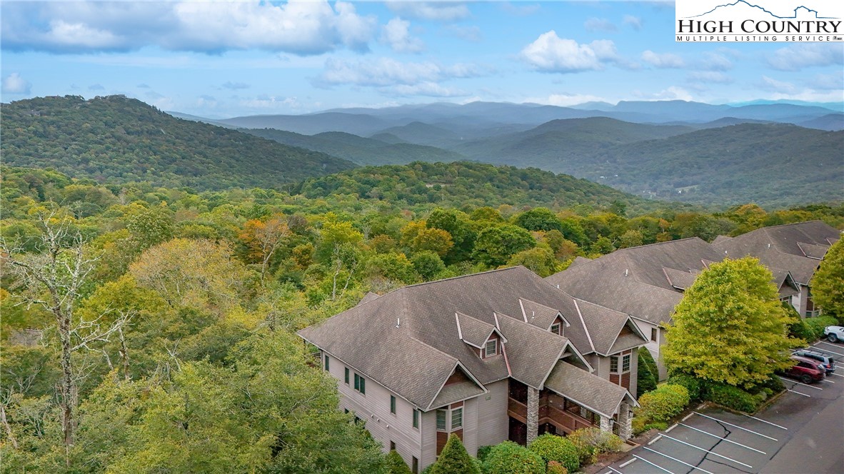 an aerial view of a house with mountain view