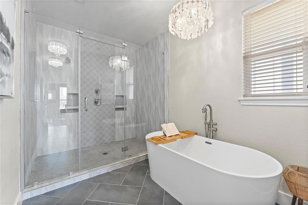 a white bath tub sitting next to a white sink