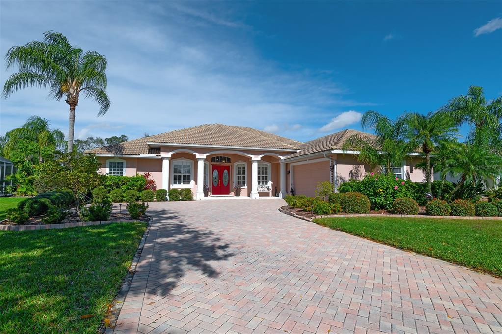 a front view of house with yard and green space