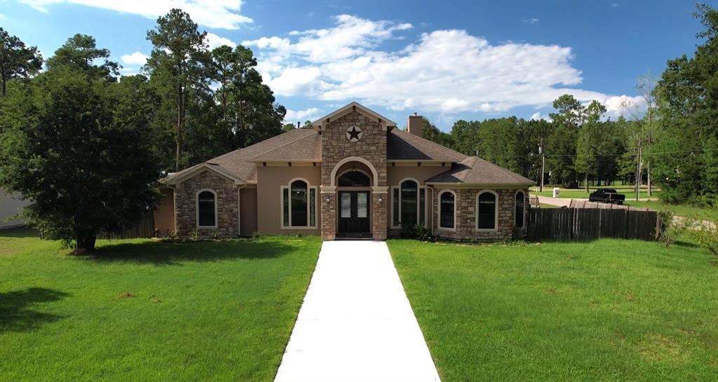 a front view of a house with yard