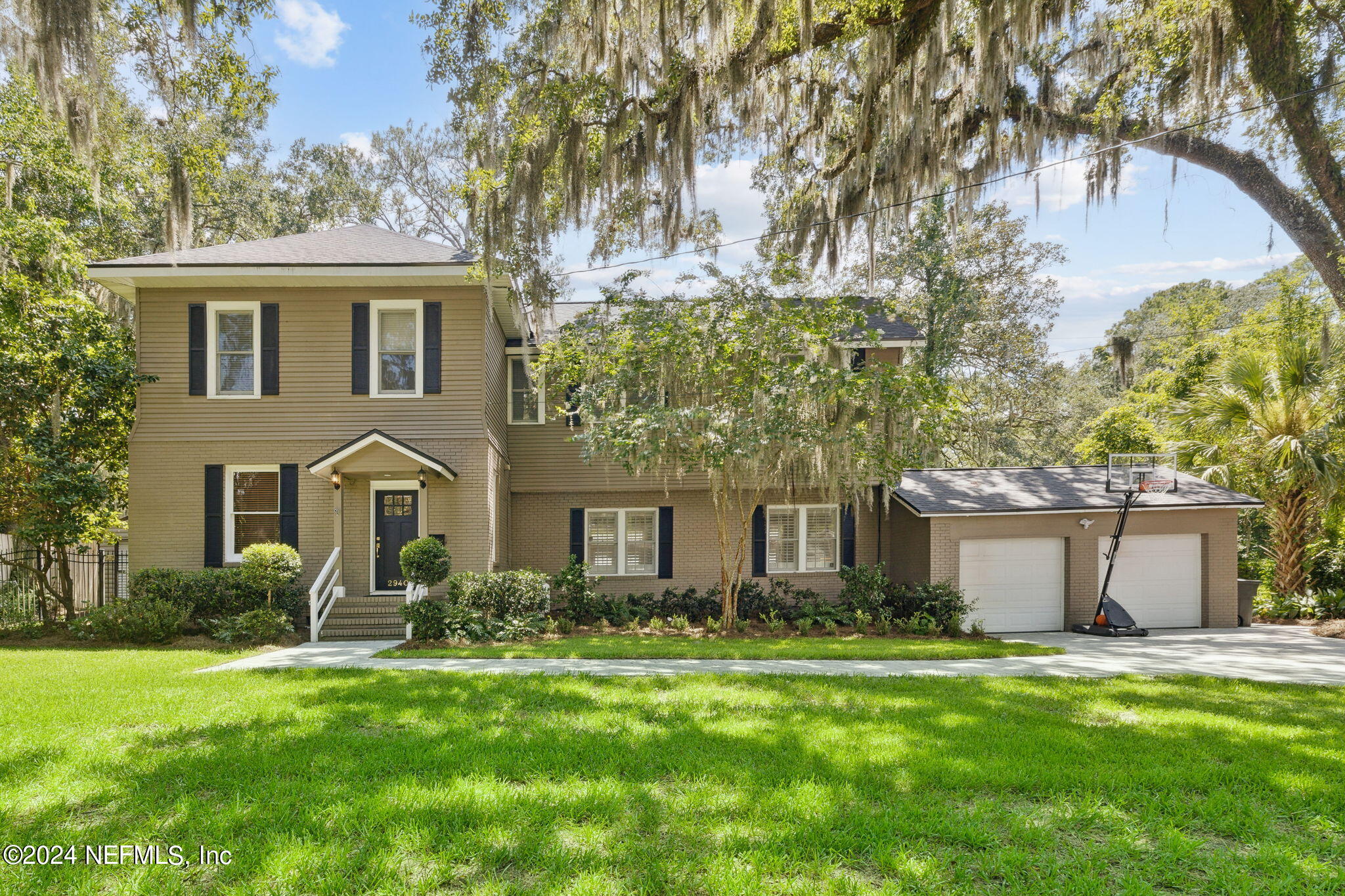 front view of a house with a yard