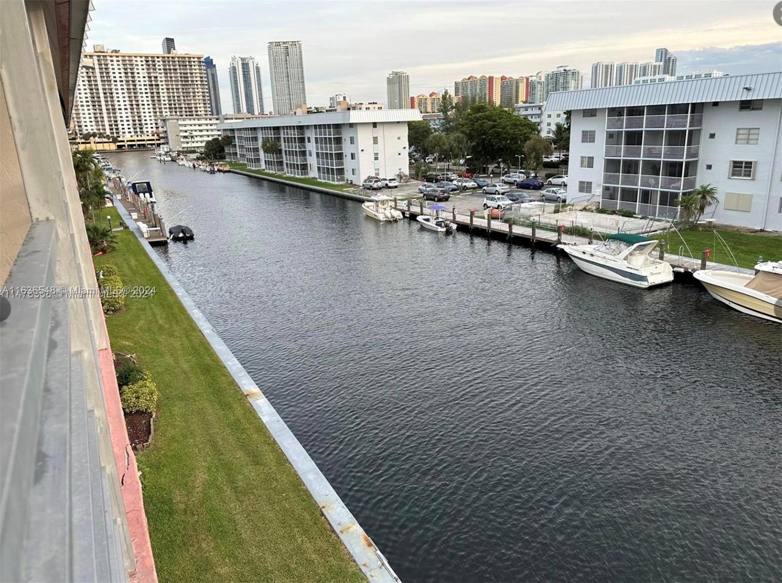 a view of residential house with outdoor space and lake view