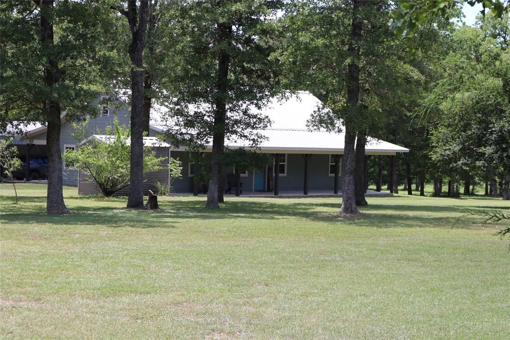 a house with trees in the background