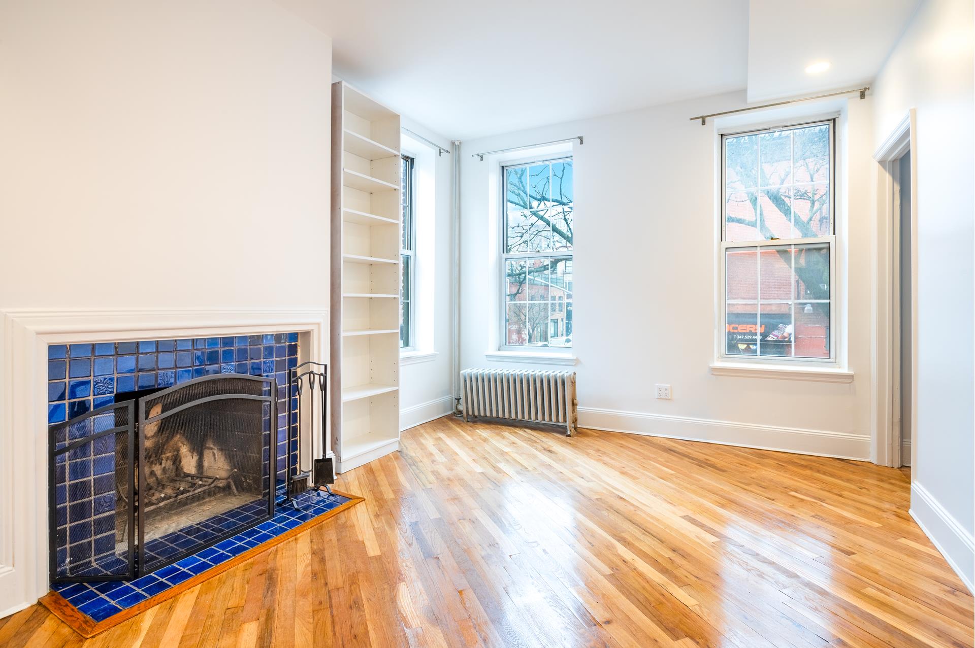 a view of livingroom with furniture and a fireplace