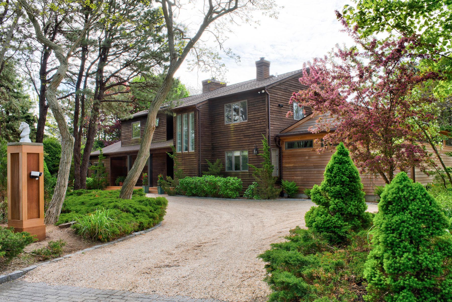 a front view of a house with garden