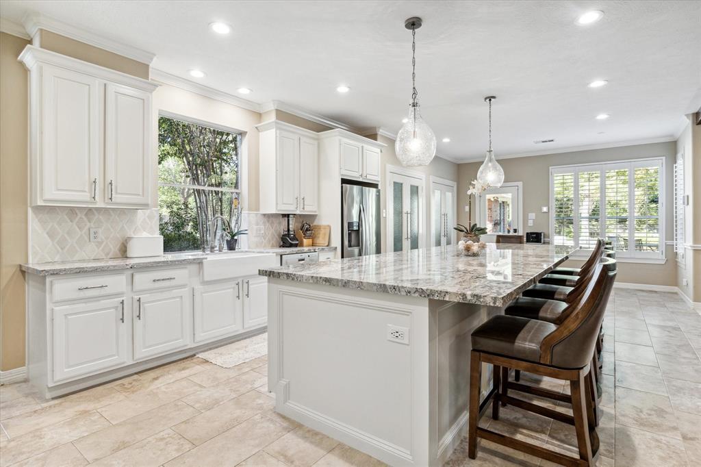 Lots of light and a 5 foot by 13 foot island.  This beautiful kitchen just beckons you to call it home!