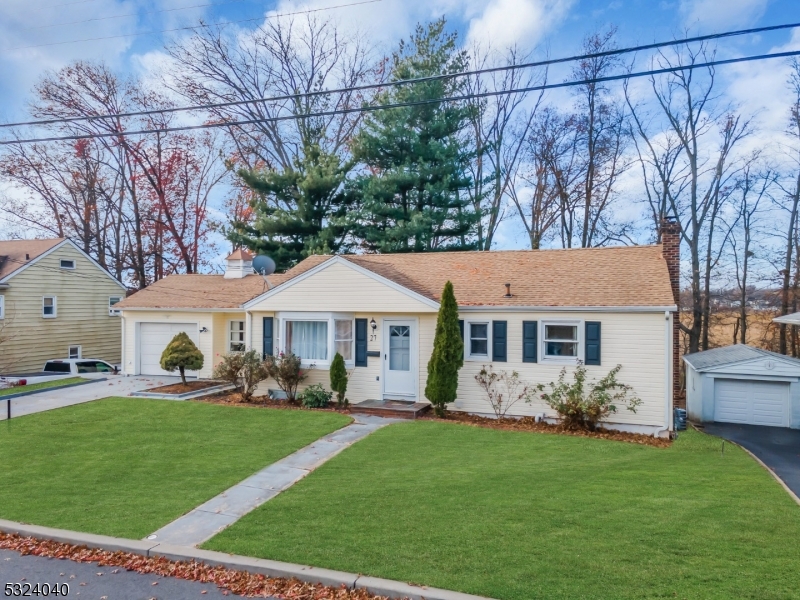 a view of house with a yard