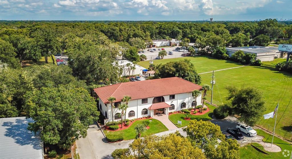 an aerial view of a house with a garden