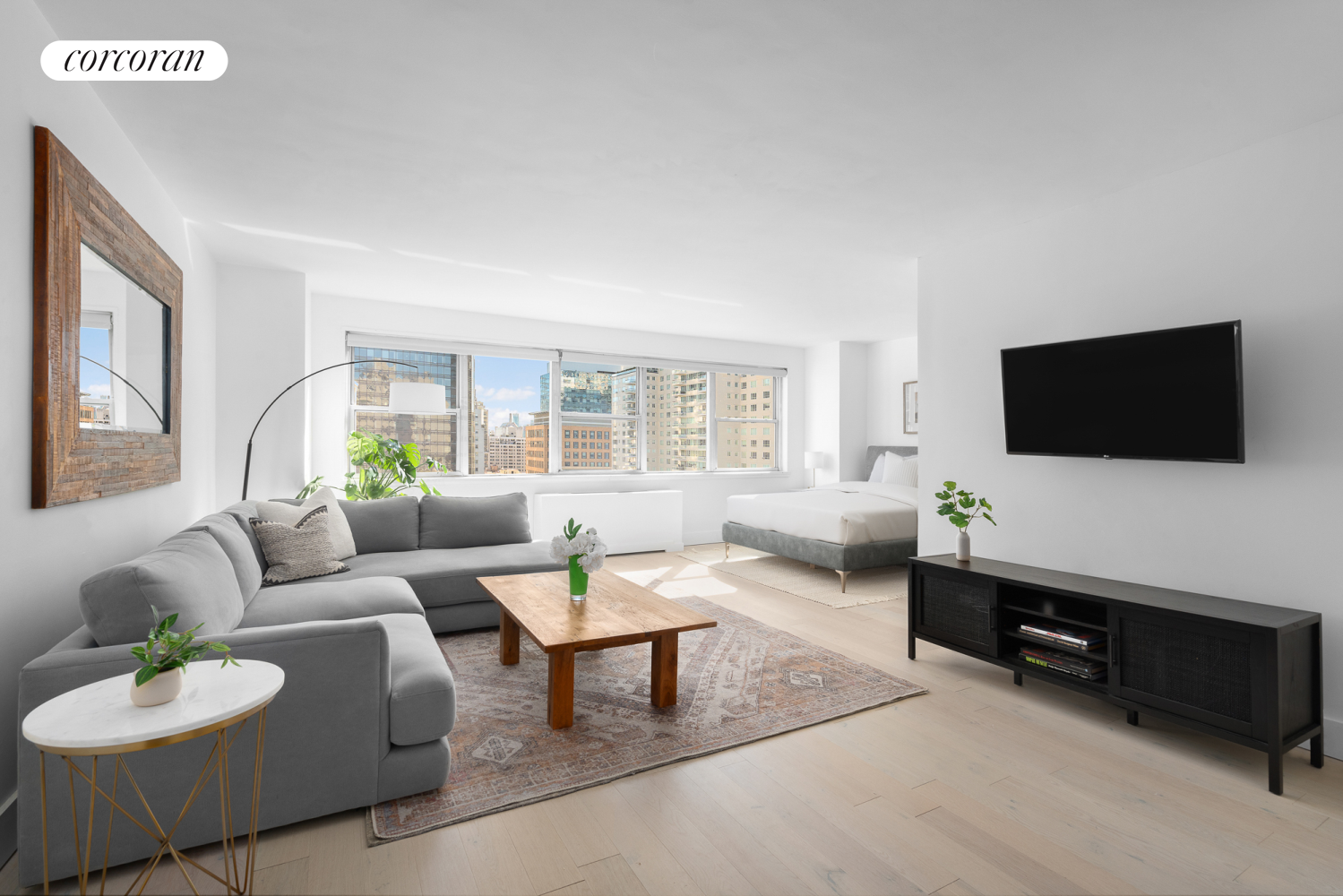 a living room with furniture and a flat screen tv