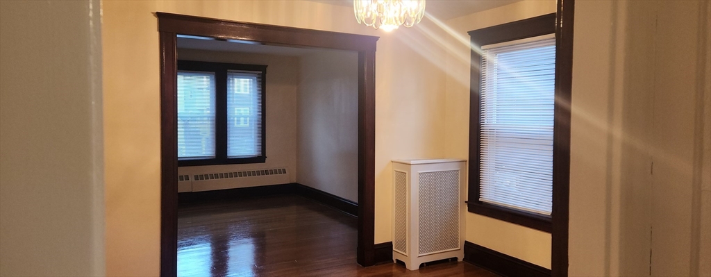 a view of front door with wooden floor