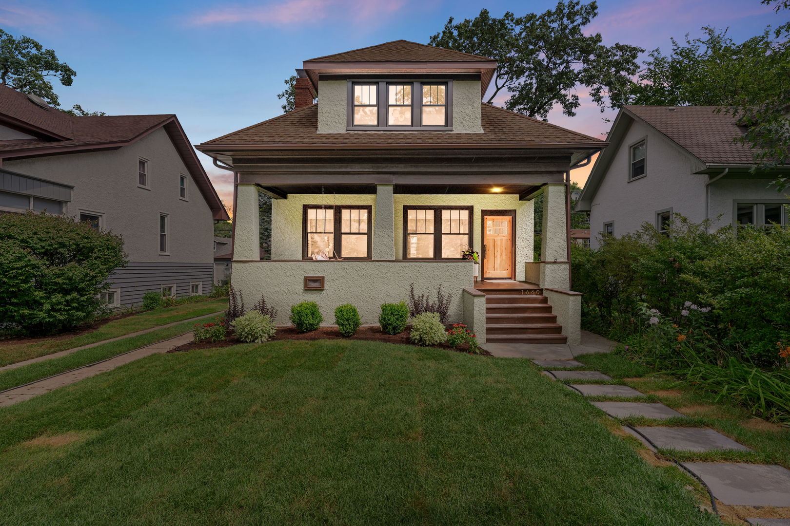 front view of a house with a yard