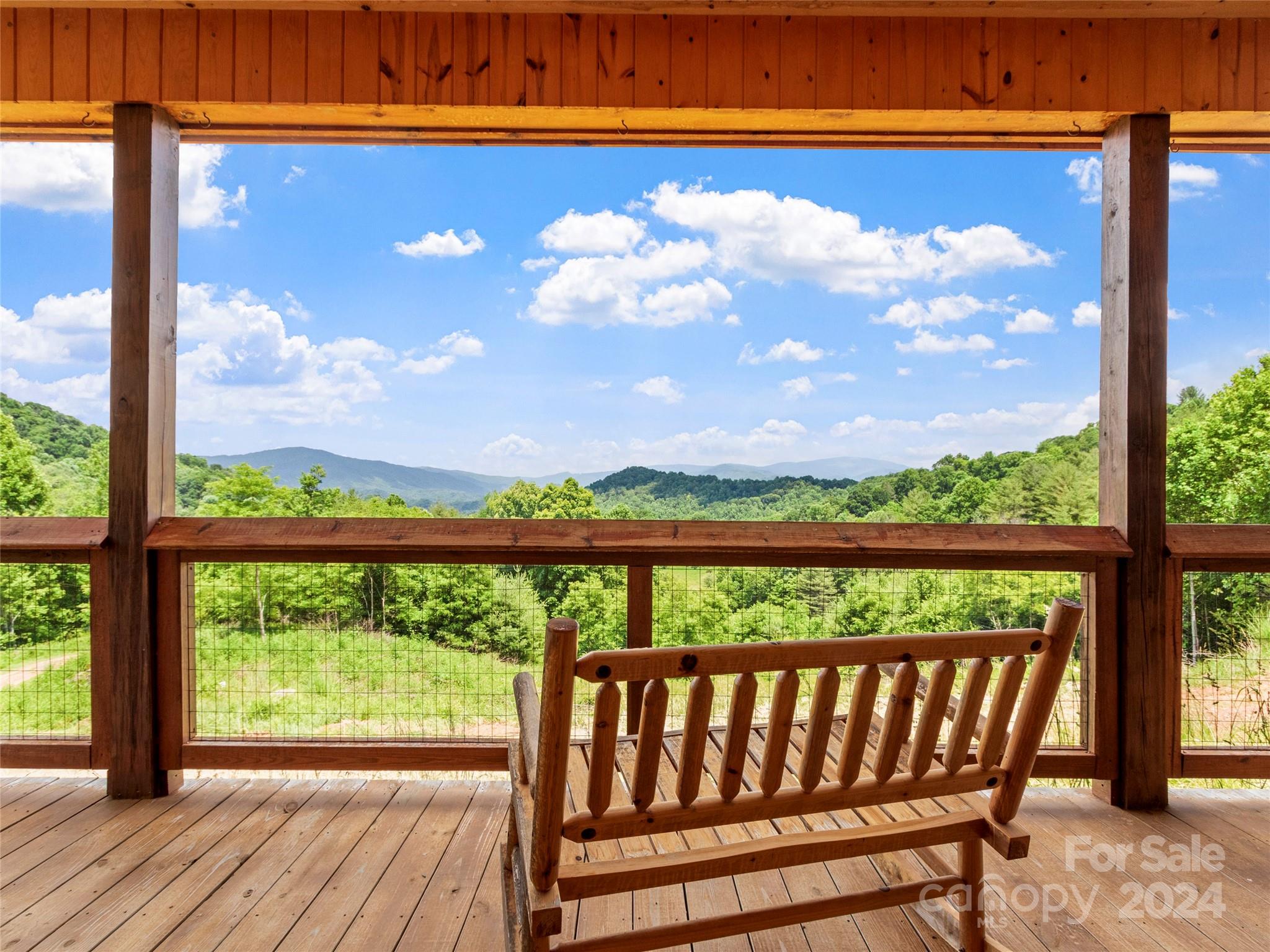 a view of a porch with wooden floor