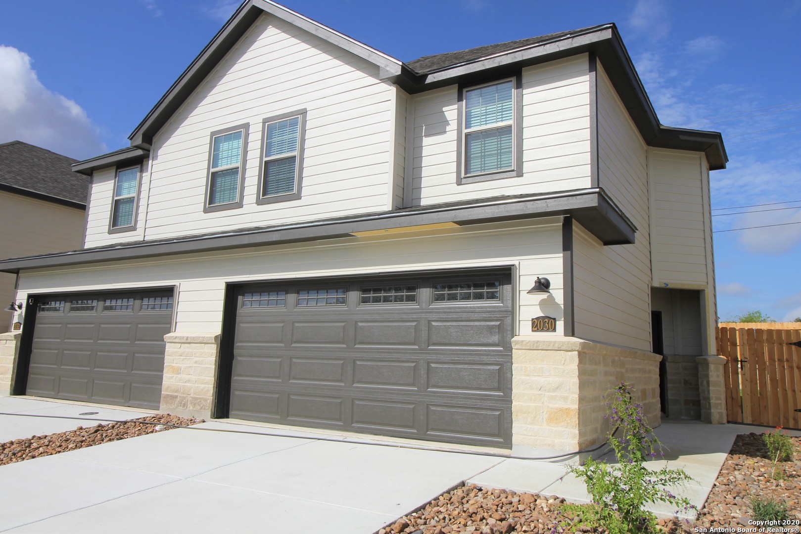 a front view of a house with a garage