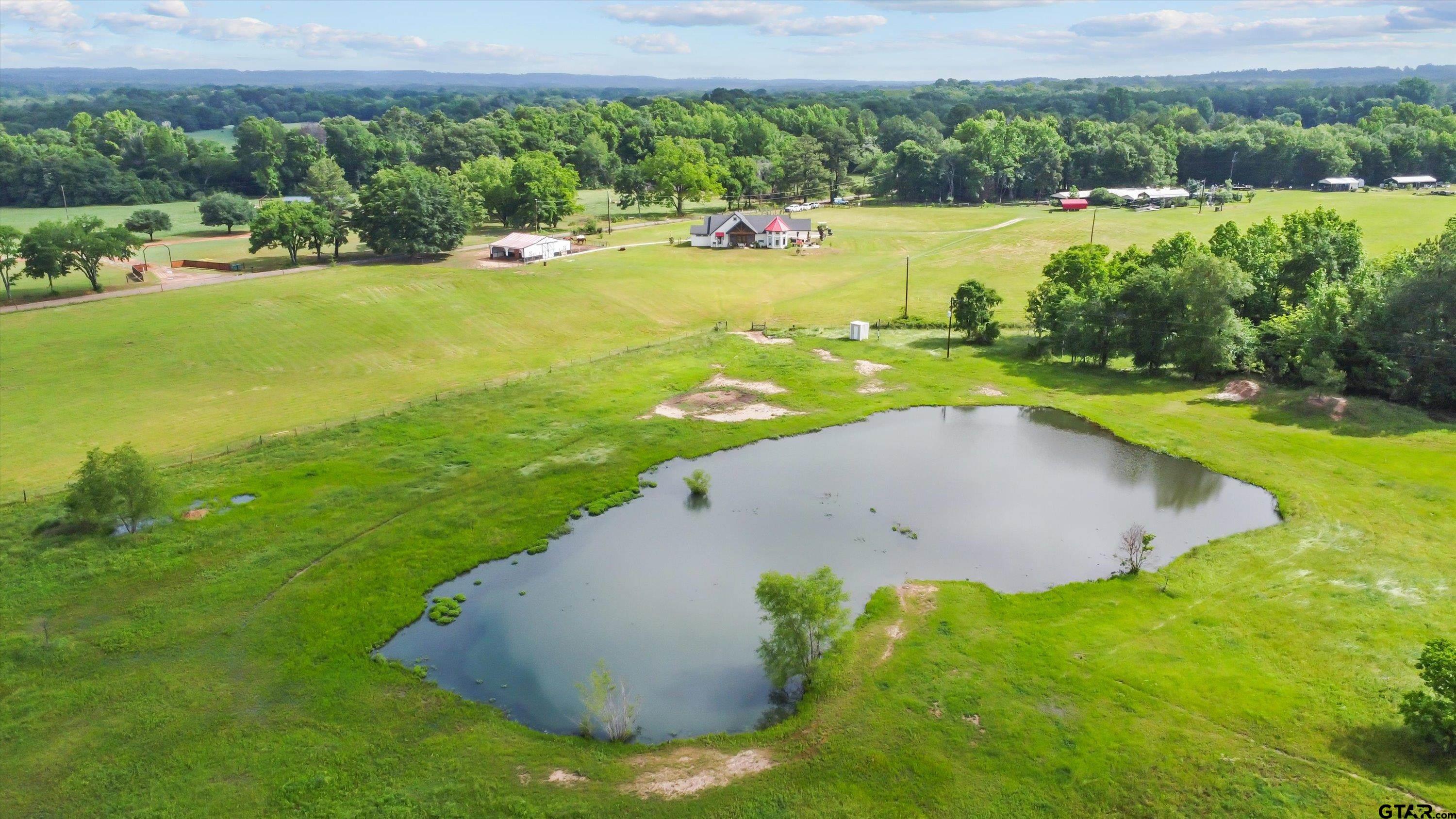 a view of a lake with a yard