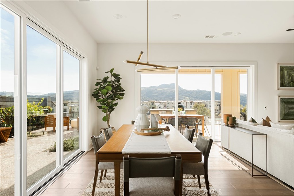 a view of a dining room with furniture window and outside view