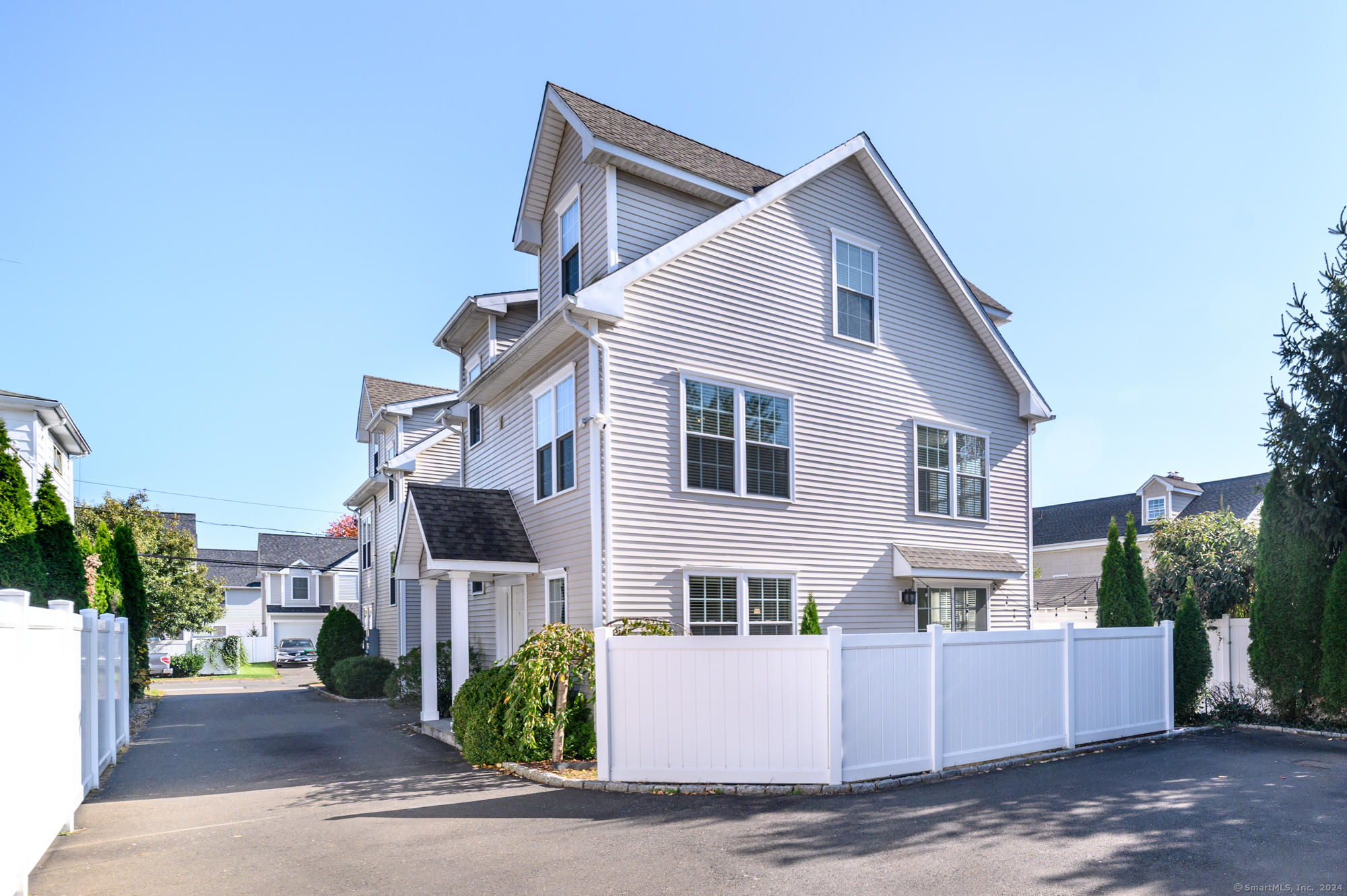 a view of a big house with a street