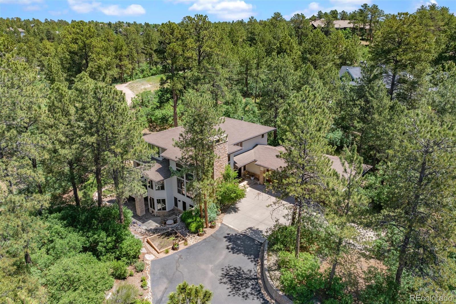 an aerial view of a house with mountain view