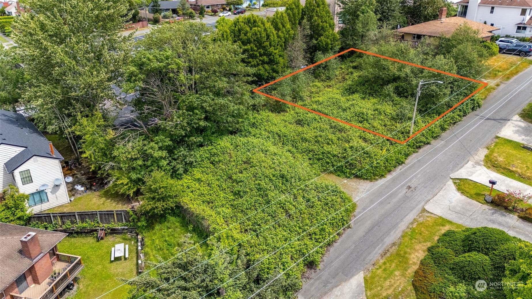 an aerial view of a house with swimming pool