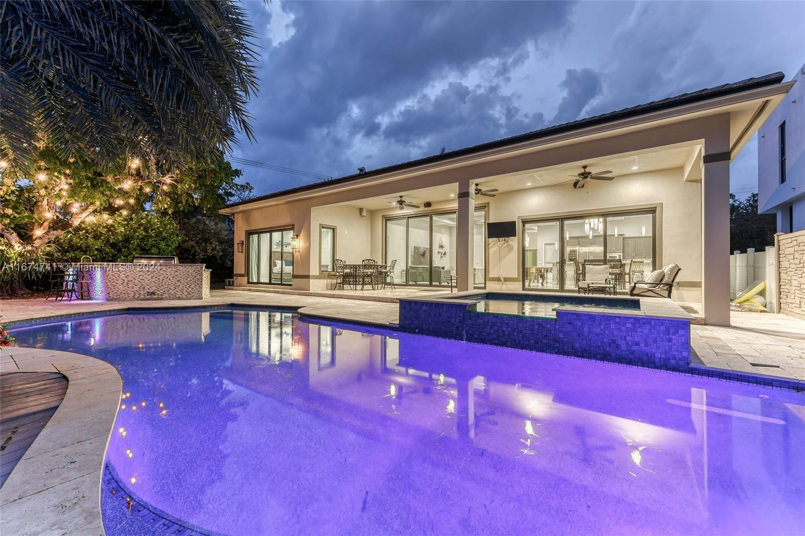 a view of swimming pool with outdoor seating